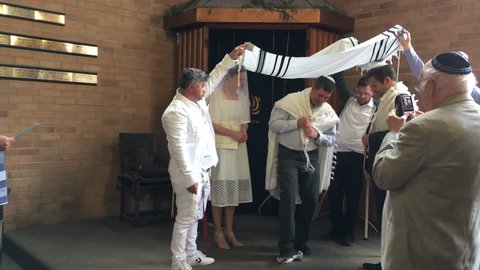 AUCKLAND - 0CT 31 2018:Jewish bridegroom breaks glass in Orthodox Jewish wedding ceremony in a synagogue.Jewish wedding is a wedding ceremony that follows Jewish laws and traditions