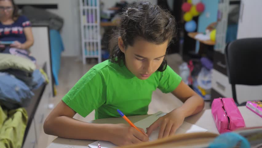 Little girl daughter do homework education lesson school. slow motion video. lifestyle preparation, back to school. little girl study with a book. school kids family concept education | Shutterstock HD Video #1018814914