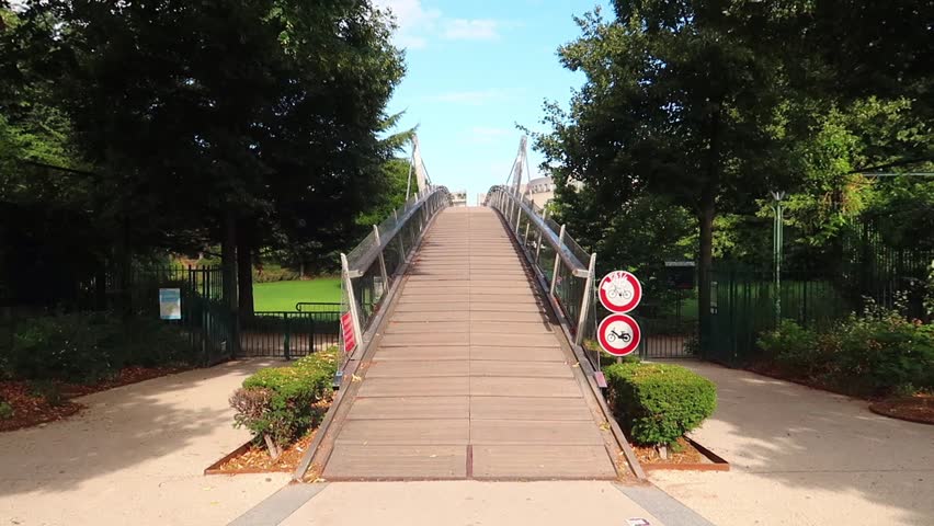 bottom up panning of a bridge at the Coulée Verte in Paris 12th disctrict