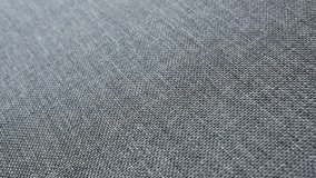 Modern gray upholstery fabric surface slow pan 4K footage