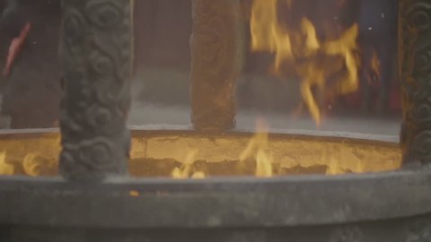 closeup of flame in a fire pit (slow motion).