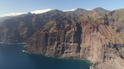 Aerial view of Los Gigantes Cliffs on Tenerife, 4K drone shot from above, Canarias islands, Spain