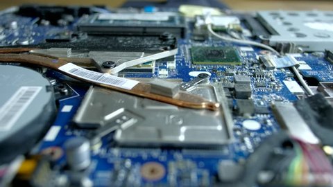 Computer Service. The serviceman cleans the interior of the laptop with dust and other dirt. 4k.