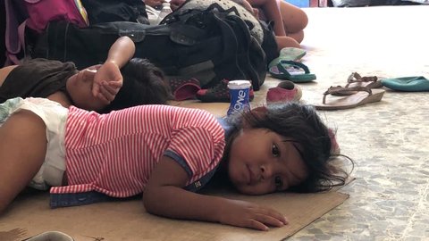Chiapas, Mexico - November 1, 2018: Immigrant Caravan Children Sleeping on Cartons in Mexico