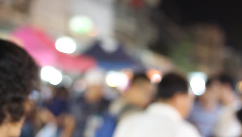 People video walking in the night market with beautiful light and blur.