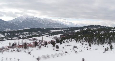 Aerial view of a village in the snowy mountains
