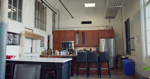 Modern kitchen in hipster tech office during the daytime. Wide to long shot on 4K RED on a gimbal.