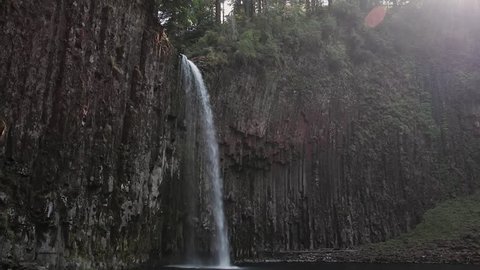 Wide shot of beautiful waterfall with fading sunlight Abiqua Falls Oregon