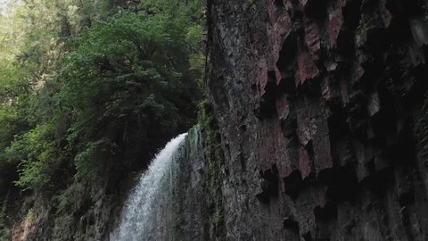tracking waterfall cascading down to pool Abiqua Falls Oregon