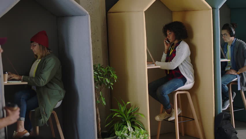 diverse group of college students working sharing creative business ideas brainstorming together enjoying study in busy office workplace