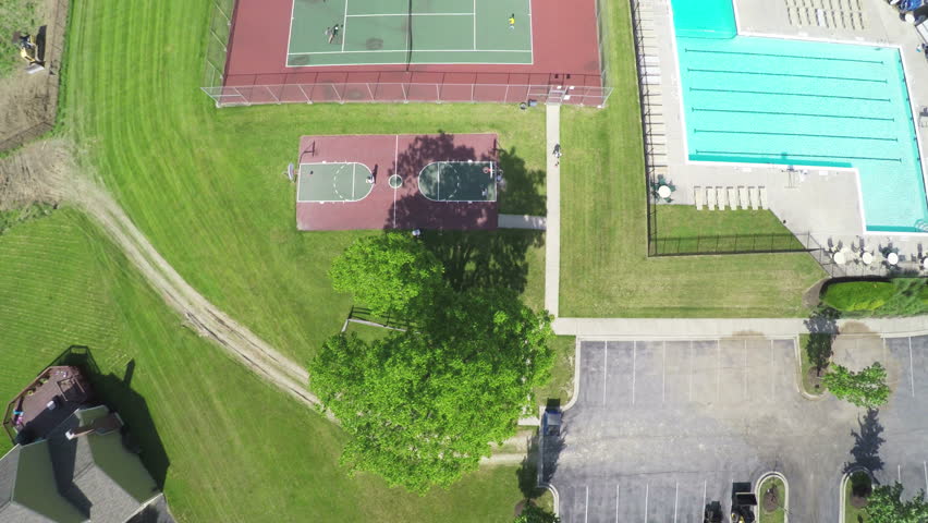 Aerial Swimming Pool Tennis and Basketball Court in Neighborhood