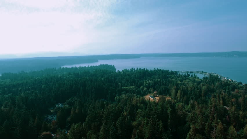 Aerial high above Bainbridge Island Washington on a hazy day