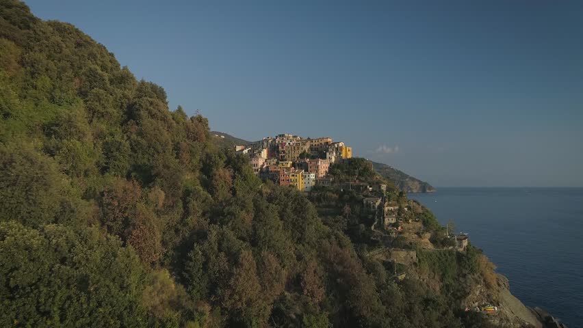 Aerial: Amazing view of cozy town Corniglia Cinque Terre Italy Europe Sunset Vivid colors Travel destination