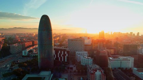 Barcelona, Spain - May 28, 2018: Torre Glories or Torre Agbar as the landmark skyscraper sunrise view from air. Barcelona is the second most populous municipality of Spain.