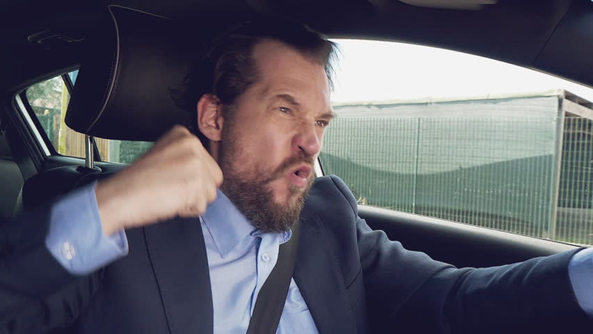 Succesful man driving car happy winner cool slow motion