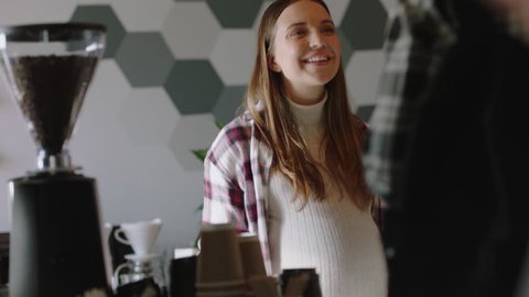 happy pregnant business woman cashier in busy cafe barista serving customers buying coffee supporting small business owner enjoying friendly service successful startup shop