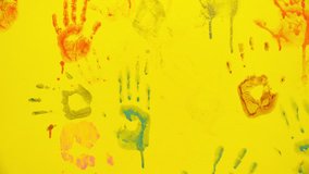 Children's hand prints on the wall. Little artists. Multicolored hands. Children's entertainment and creativity. Games in the company of friends. Happy childhood - Powered by Shutterstock - Get 15% off with code: PIKWIZARD15