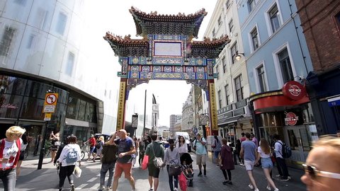London, UK - June 24, 2018: Chinatown China town Wardour street road with many crowd of people, downtown city, gate entrance