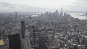 New York, the day goes into the night, the clouds float dramatically over the city. Aerial HD video timelapse
