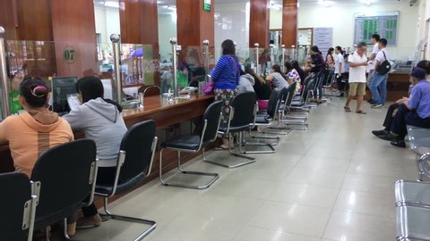 VUNG TAU, VIETNAM - SEPTEMBER 25, 2017: Unidentified people sit in the client servicing room of a Vietcombank. Vietcombank is a large commercial bank having 89 branches in Vietnam.