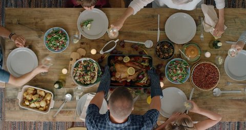 happy family enjoying thanksgiving lunch together enjoying healthy homemade feast holiday celebration holiday meal overhead tracking