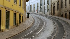 Empty street and railway in historical city of Lisbon.