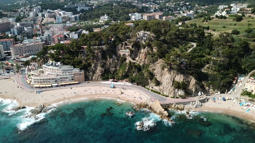 View from drone of Spanish town of Lloret de Mar on Mediterranean coast in summer day