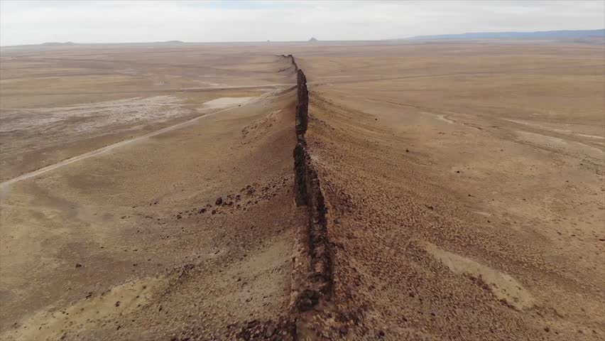 Aerial shot of Shiprock rock formation in desert in summer, San Juan County, New Mexico, United States of America
