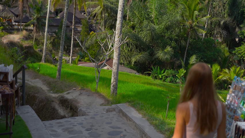 Slowmotion shot of a family visiting the Gunung Kawi Sebatu Temple on the Bali island