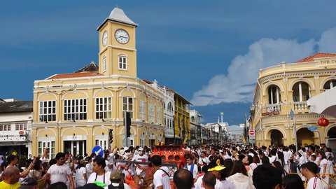 Phuket,Thailand-October 14th,2018: The infinity of devotees rolling in a parade of Bangneo shrine between nine days of vegetarian festival at clock tower in old phuket town this morning,4K time lapse.