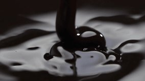 Pouring melted dark chocolate.
