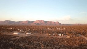 Drone footage of the open desert skies. Sunsets and orange skies. 1080p HD. Open lands. Canyon, Open desert with lots of joshua trees,