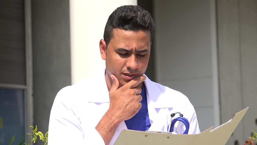 Confused Hispanic Male Doctor Royalty-Free Stock Footage #1018945405