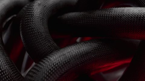Clew of black wire moving and rotating like snake with red hell light