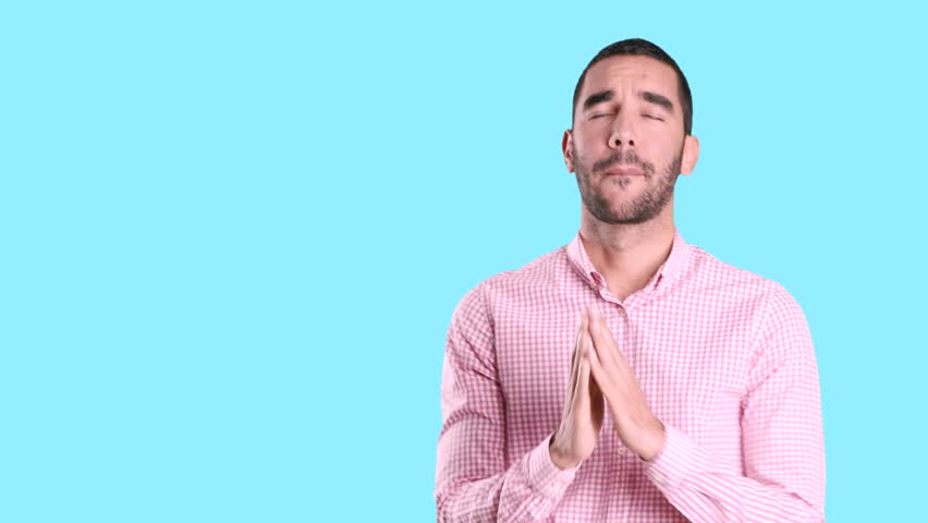Video of a worried young man praying | Shutterstock HD Video #1018966051