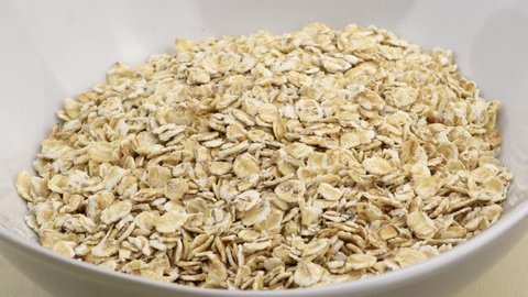 Bowl of oatmeal rotating close-up