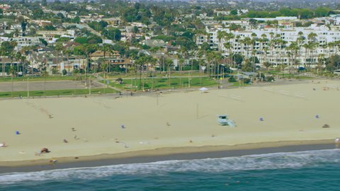 Aerial view of Venice beach shoreline on a sunny day in Los Angeles, California. Shot on 4K RED camera.