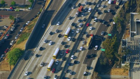 Aerial view of downtown LA traffic on the freeway on a sunny day in Los Angeles, California. Shot on 4K RED camera.