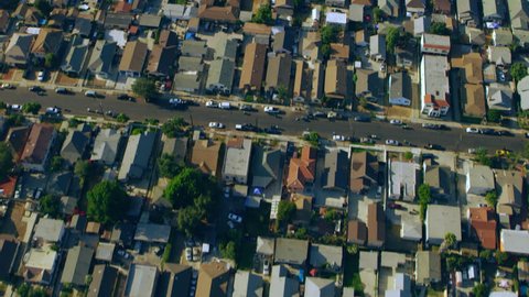 Los Angeles, California circa-2018: Aerial view of suburban houses near Olympic stadium on a sunny day in Los Angeles, California. Shot on 4K RED camera.