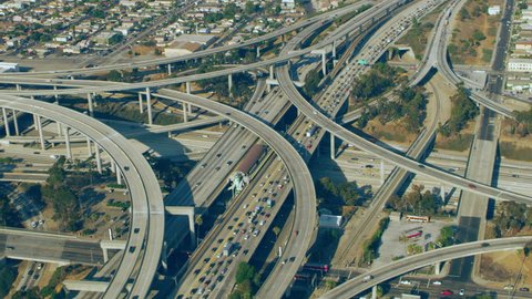 Aerial view of 110 Highway traffic on a sunny day in Los Angeles, California. Shot on 4K RED camera.