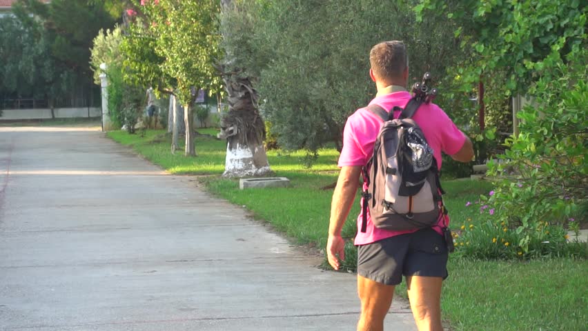 Travel Man With A Backpack Is Walking 