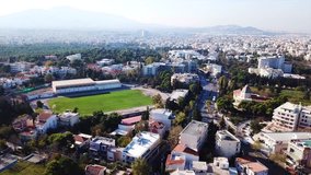 Aerial drone video of iconic public stadium and sports facilities of Zirinio in suburb of Kifisia, North Athens, Attica, Greece