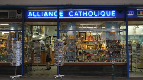 LOURDES, FRANCE on September 13th: Alliance Catholic gift shop in Lourdes, France on Sept 13th, 2018. Lourdes, France is a destination for pilgrims, especially those seeking healing.