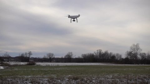 4 K Drone Hovering Above Grass Then Flying Off To Right