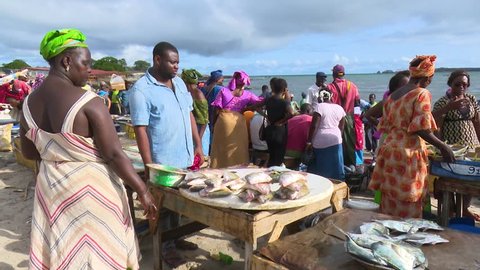 Dakar, Senegal - 07 25 2016: Dakar, Senegal - July 26, 2016: The typical Soumbedioune fish market in Dakar with fish-boat and sellers