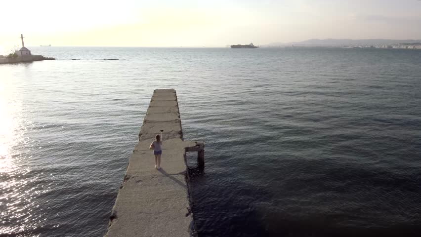old pier near the city by drone