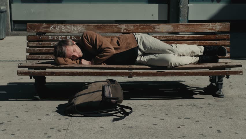 Man traveling by airplane. Tired passenger sleeping in airport terminal park bench student campus