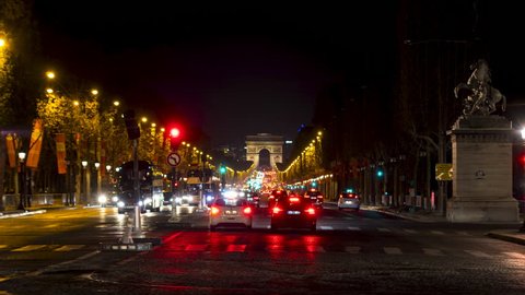 Timelapse - Night Traffic on Champs-Elysees with Arc de Triomphe in background, from place de la Concorde - Paris, France