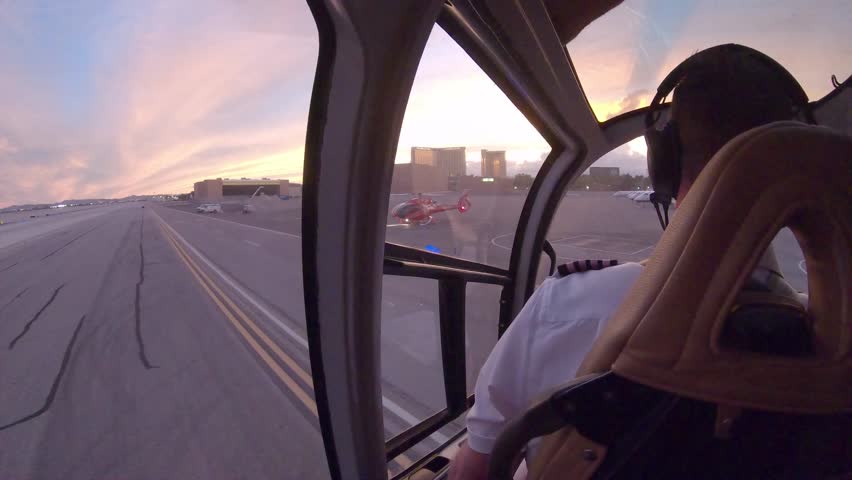 Helicopter pilot landing during the sunset in Las Vegas airport