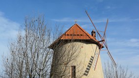 Close up view of the windmill on the background of blue sky